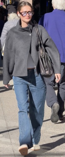 grey high-neck button coat and relaxed jeans