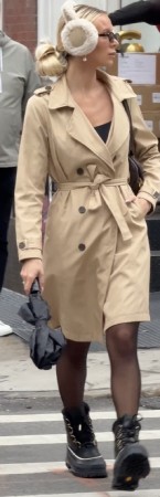 mid-cut tan trench coat over sleek black tights