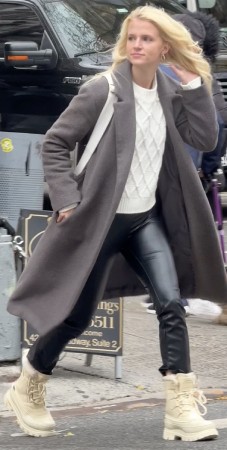 black patent pants and a crisp white knit turtleneck