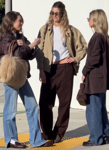 light-wash bootcut jean, brown leather jacket